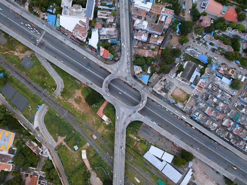 Newly developed wide roads with street lighting and avenue trees in East Tambaram near Mappedu.